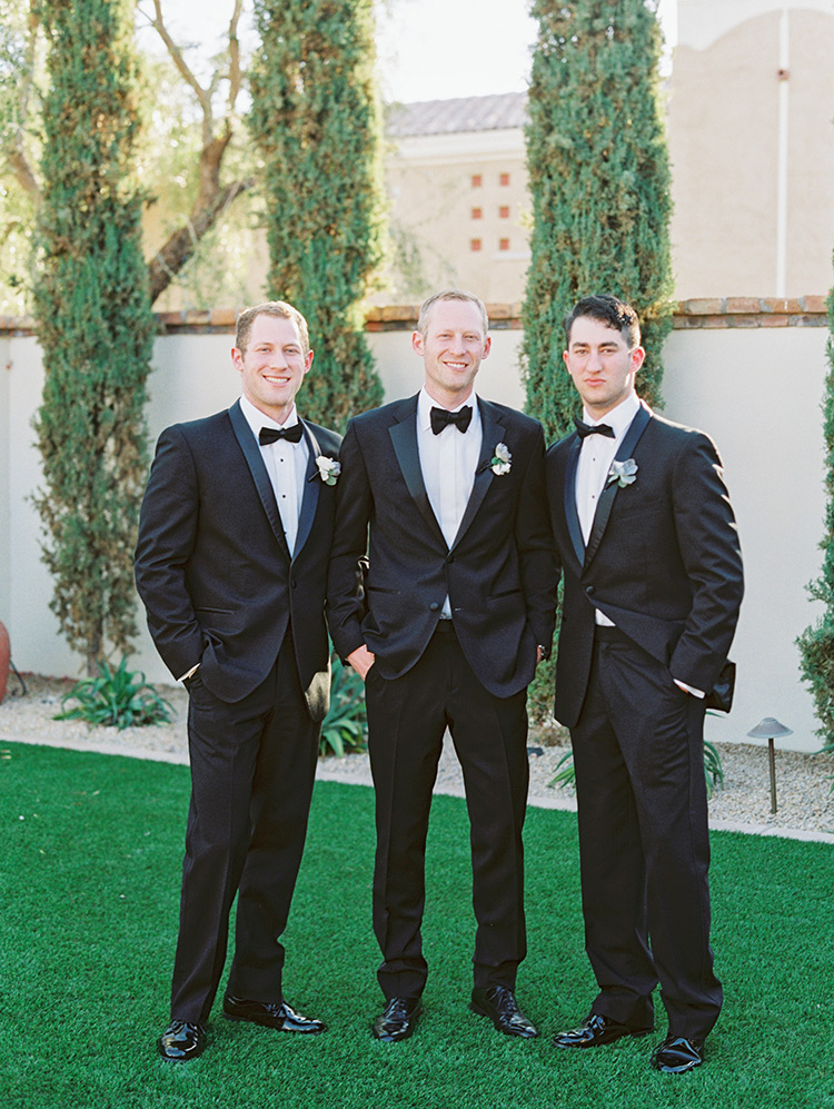 groomsmen in classic black tuxes