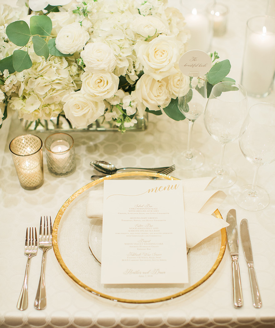 elegant ballroom reception with white flowers