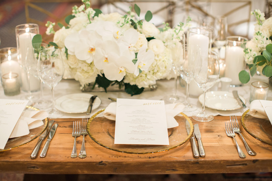 elegant ballroom reception with white flowers