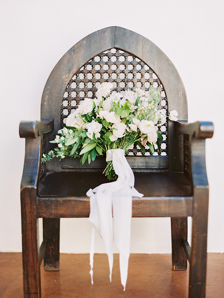 pale, romantic bouquet with soft ribbons