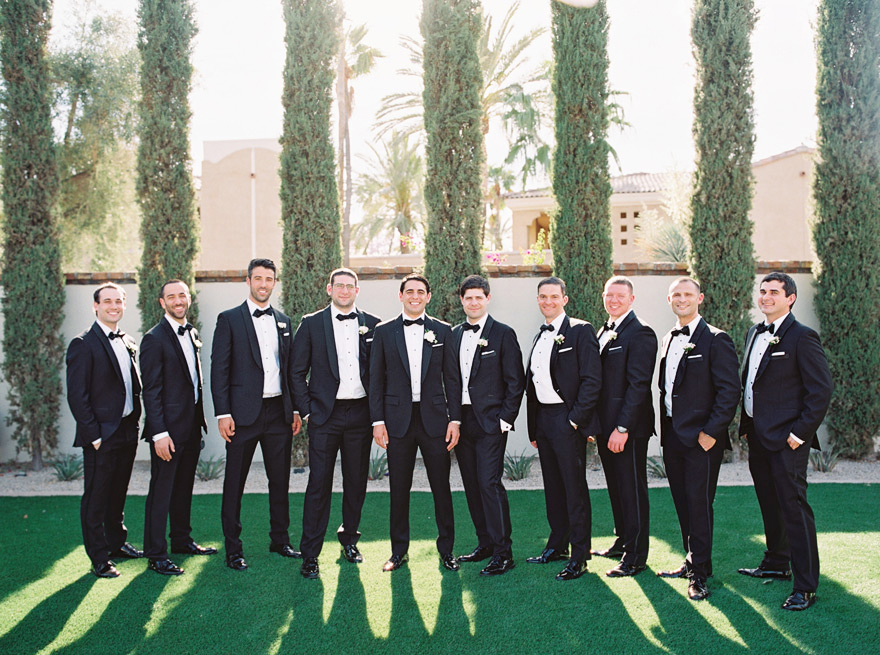 groomsmen in classic black tuxedoes 
