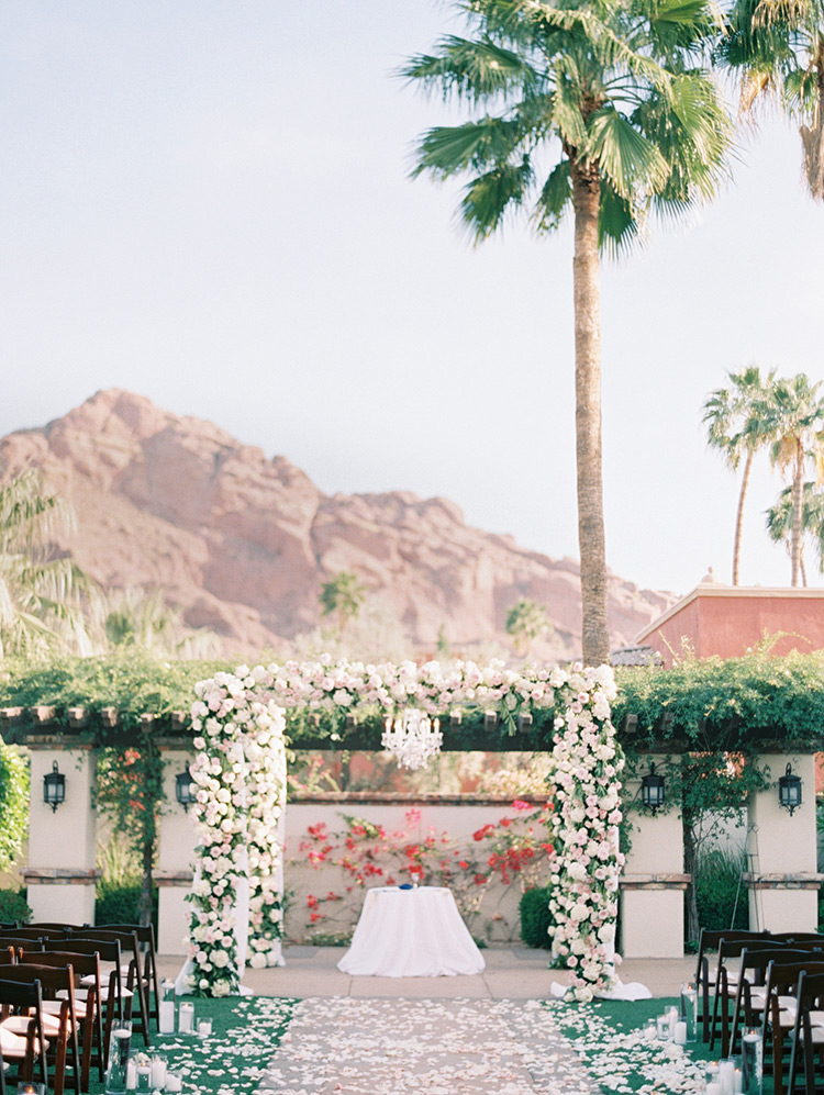 flower-decked chuppah for an outdoor wedding