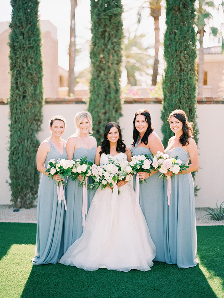 bridesmaids in grey with blush bouquets