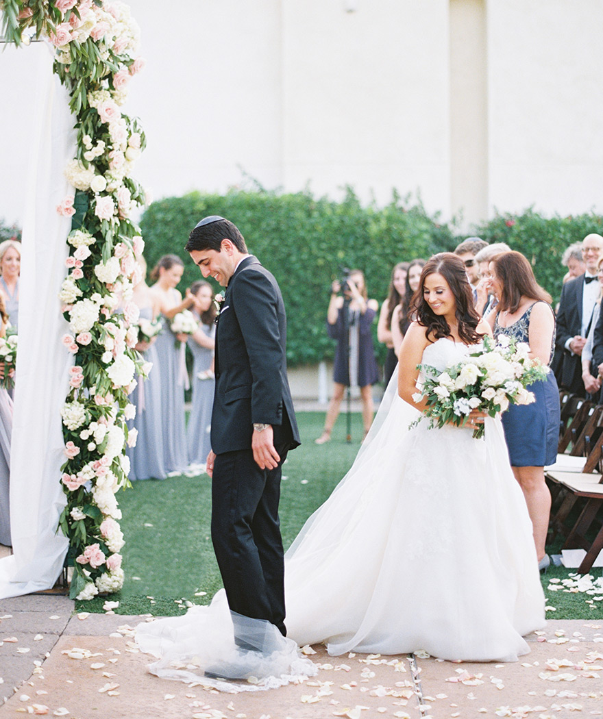 groom circles the bride during an outdoor wedding