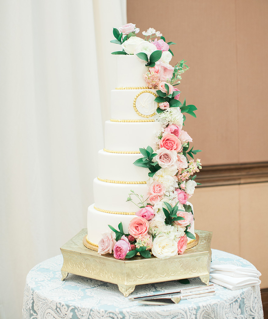 elegant six-tier wedding cake with pink flowers