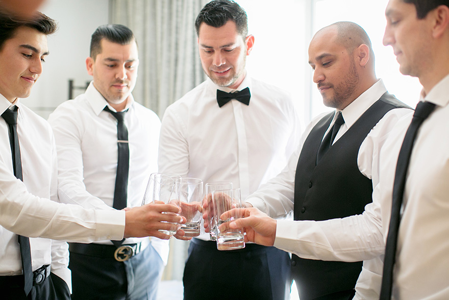 groomsmen celebrate together
