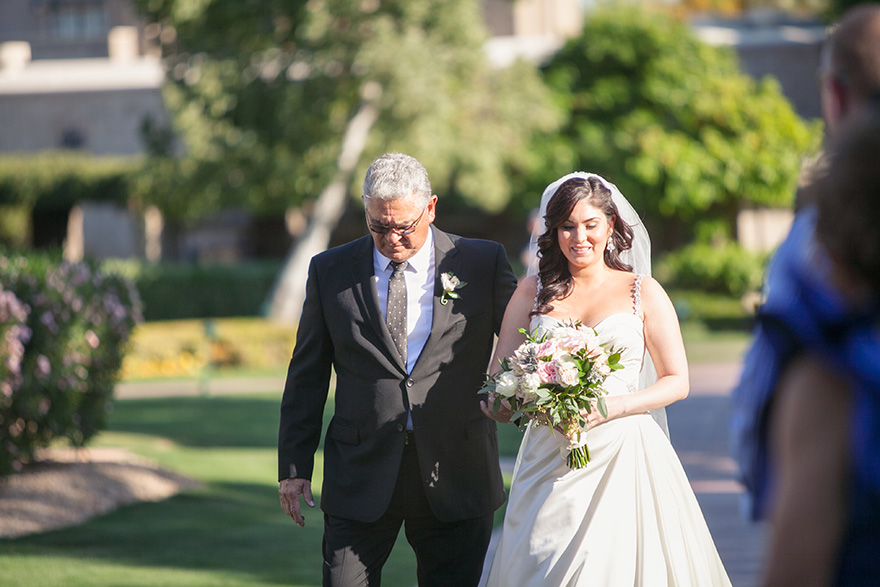father of the bride walks his daughter down the aisle