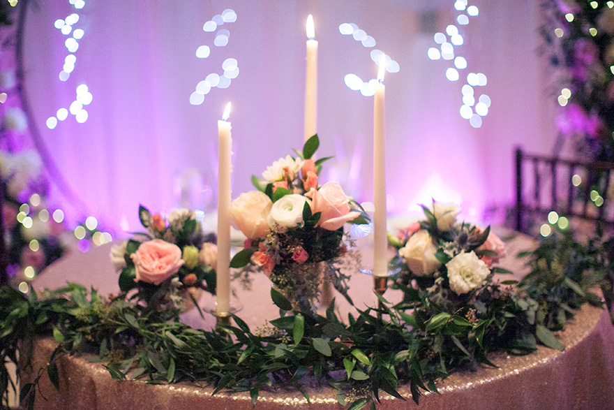 wedding reception with flowers and candlelight 