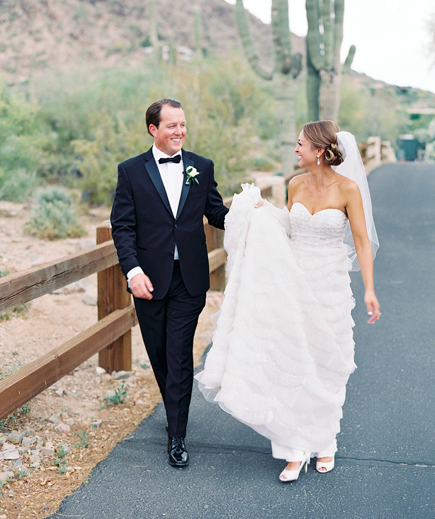 Happy bride & groom enjoy time together before the wedding. Desert wedding. 