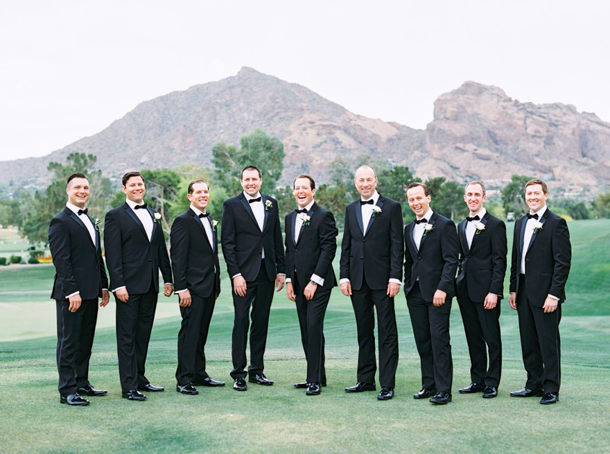 Groomsmen in classic black tuxedos