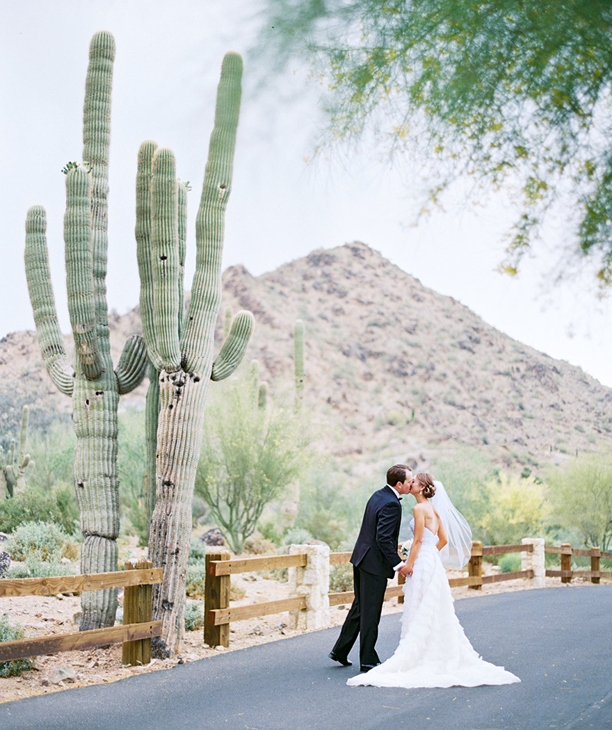Kissing beside a cactus! Bride & groom spend time before the wedding.