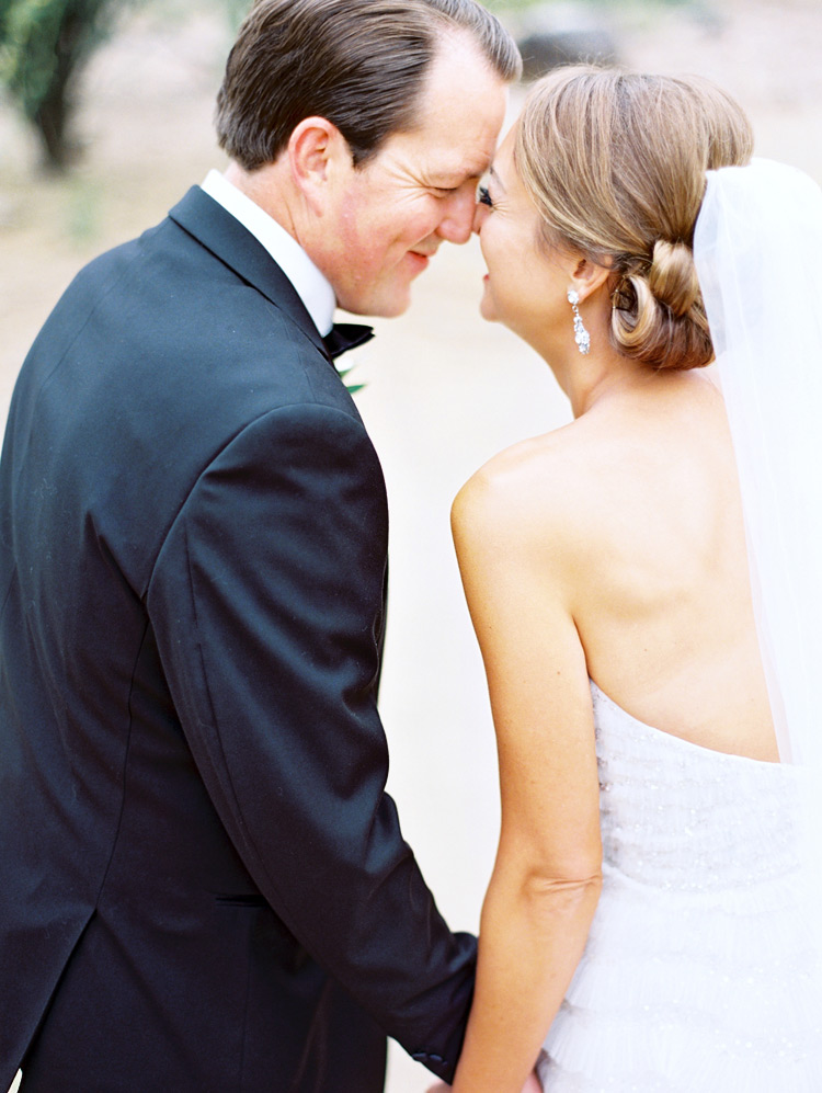 Sweet nuzzle as the bride & groom spend a happy moment together
