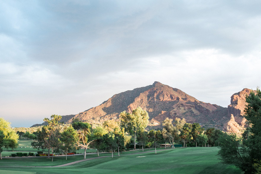 Arizona landscape with smooth green lawns and desert backdrop