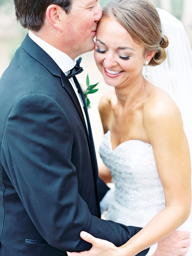 Happy moment before the wedding!  Smiling bride & groom embrace
