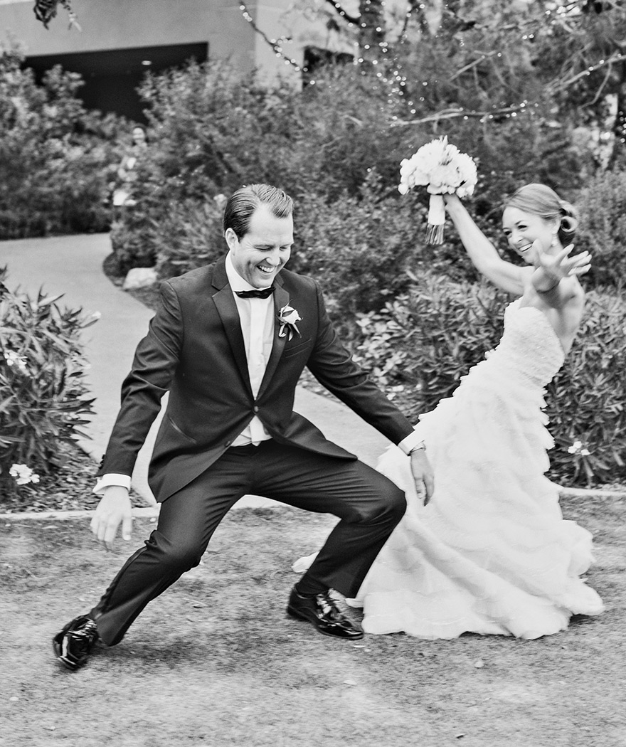 Giddy with happiness, bride & groom dance into their reception