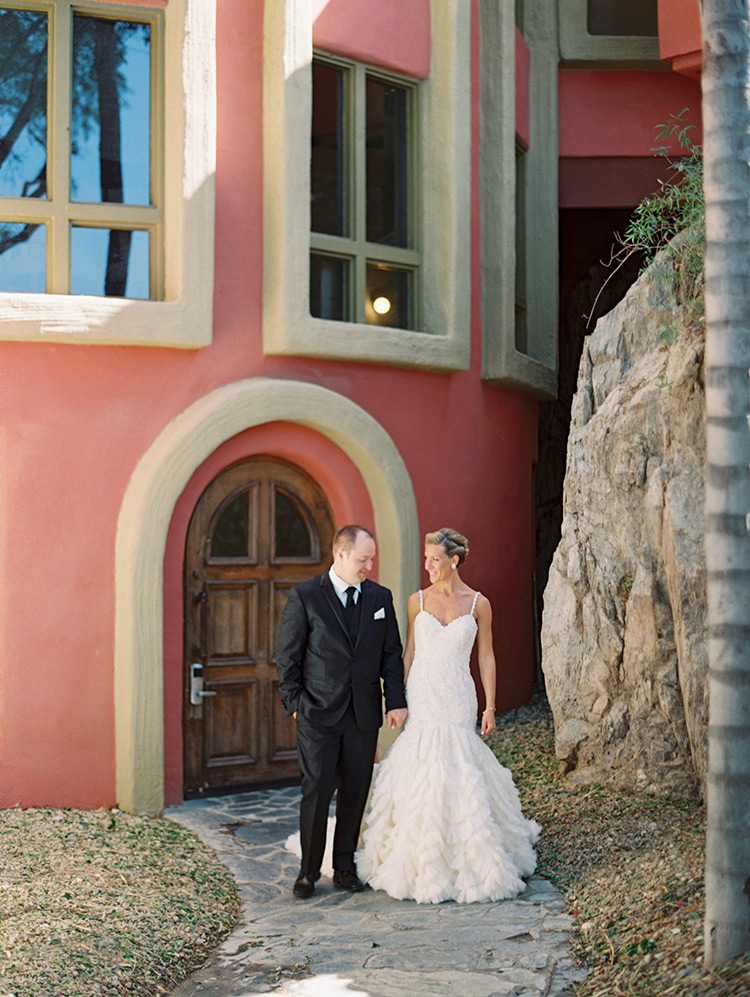 beaded wedding gown from Enaura and a black three-piece suit