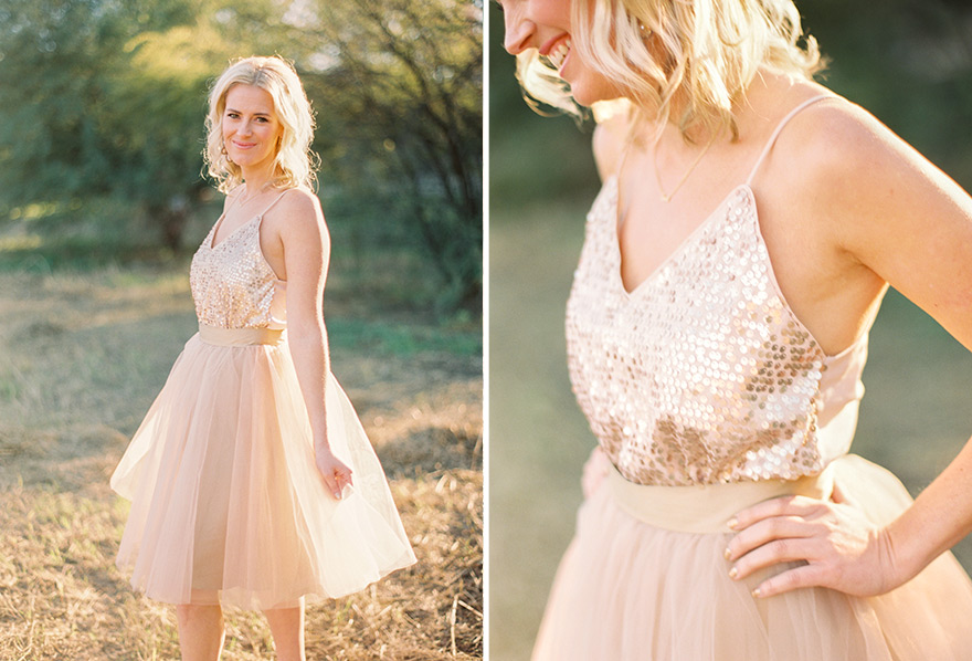 Fun outdoor photo shoot of blush tulle girl smiling. 