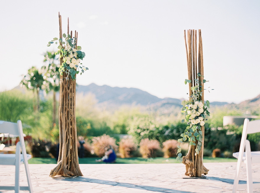 outdoor wedding ceremony with Saguaro cactus skeletons