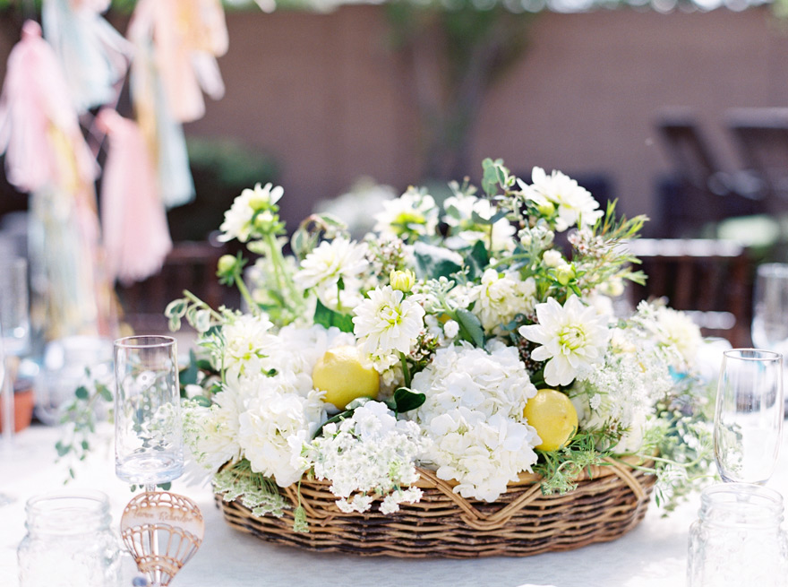 Centerpiece of white flowers studded with lemons