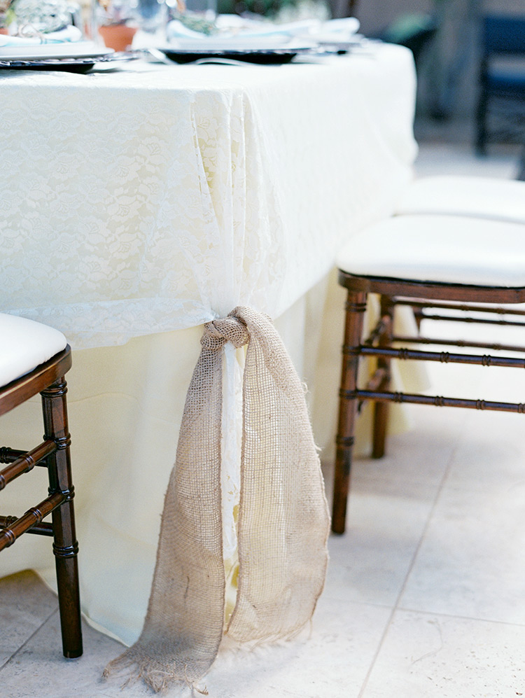 Lace tablecloth tied with burlap 