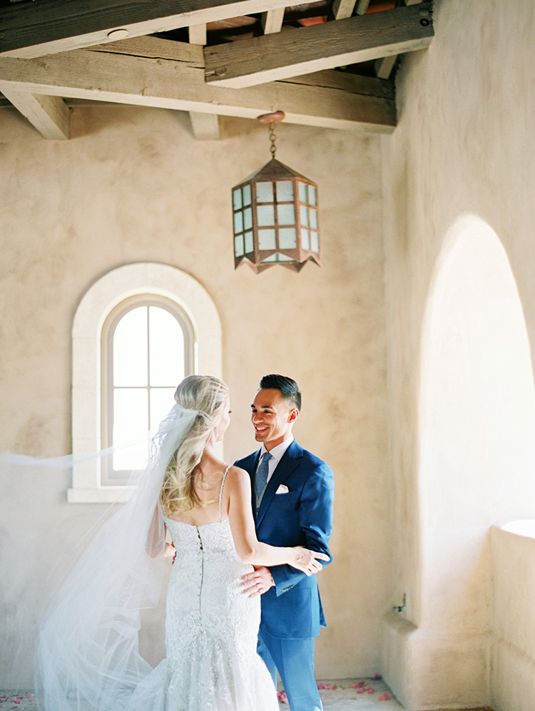 lace & tulle wedding gown for the bride, blue suit for the groom