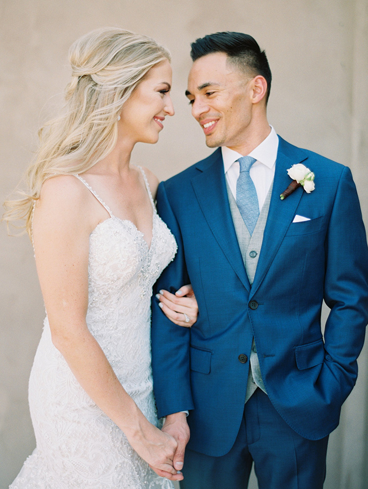 lace & tulle wedding gown for the bride, three-piece suit for the groom