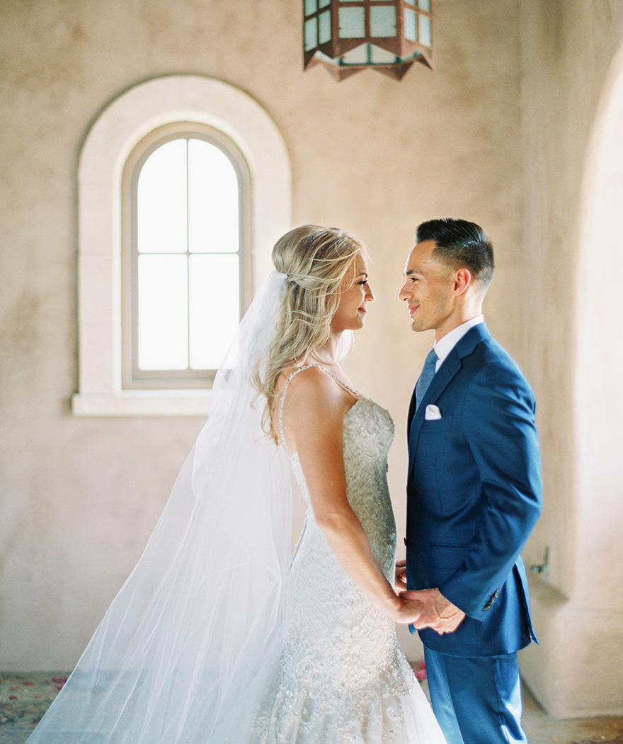 lace & tulle wedding gown for the bride, blue suit for the groom
