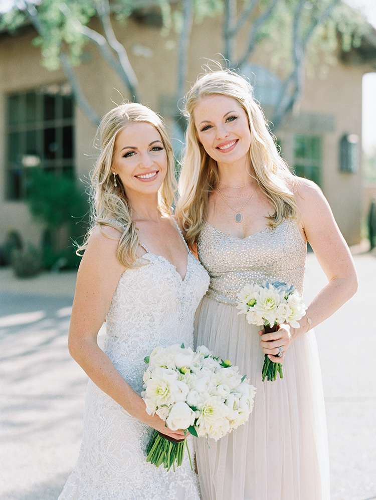 bridesmaid in sparkling neutral dress, lace & tulle wedding gown for the bride