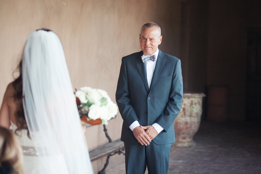 Father of the bride with tears in his eyes as he sees his daughter on her wedding day