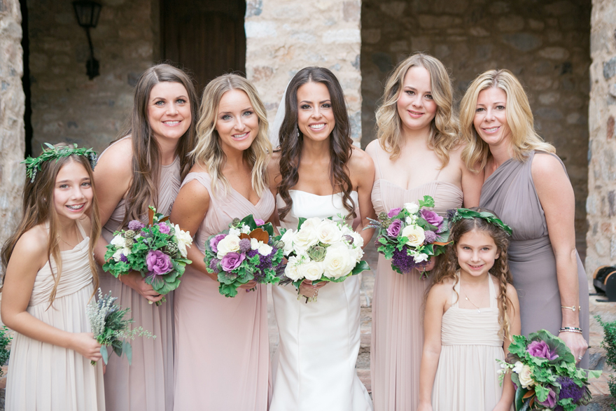 Bridesmaids in draped gowns in neutral colors. Vegetable bouquets with kale, artichokes, flowers.
