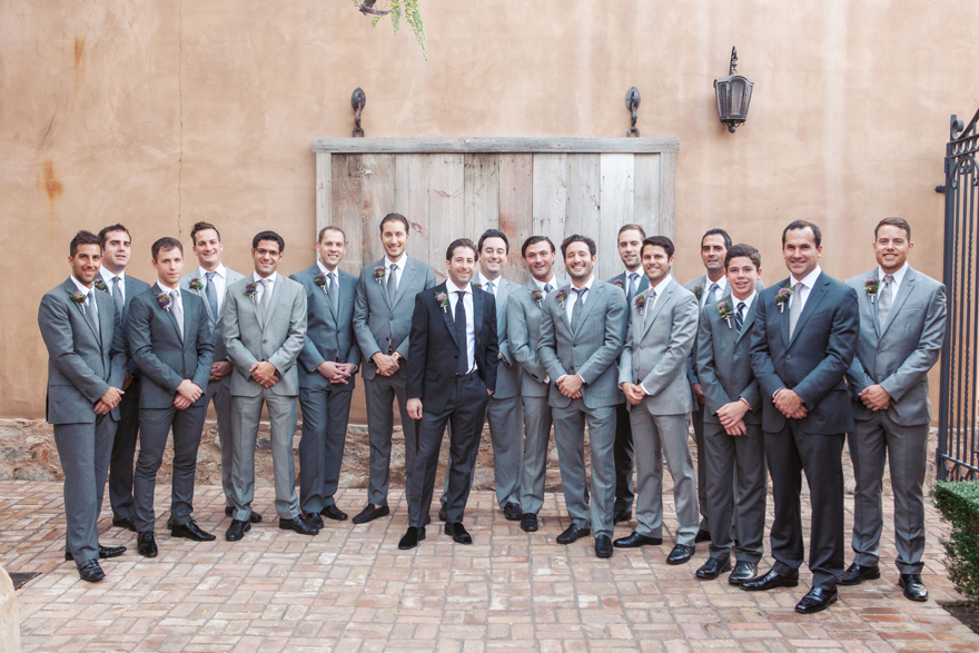 Large bridal party of 16 groomsmen in gray suits