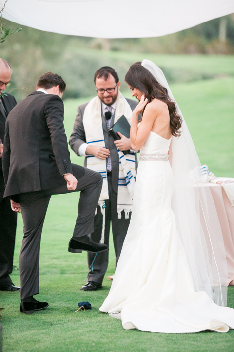 Groom stomps the glass. Outdoor wedding ceremony