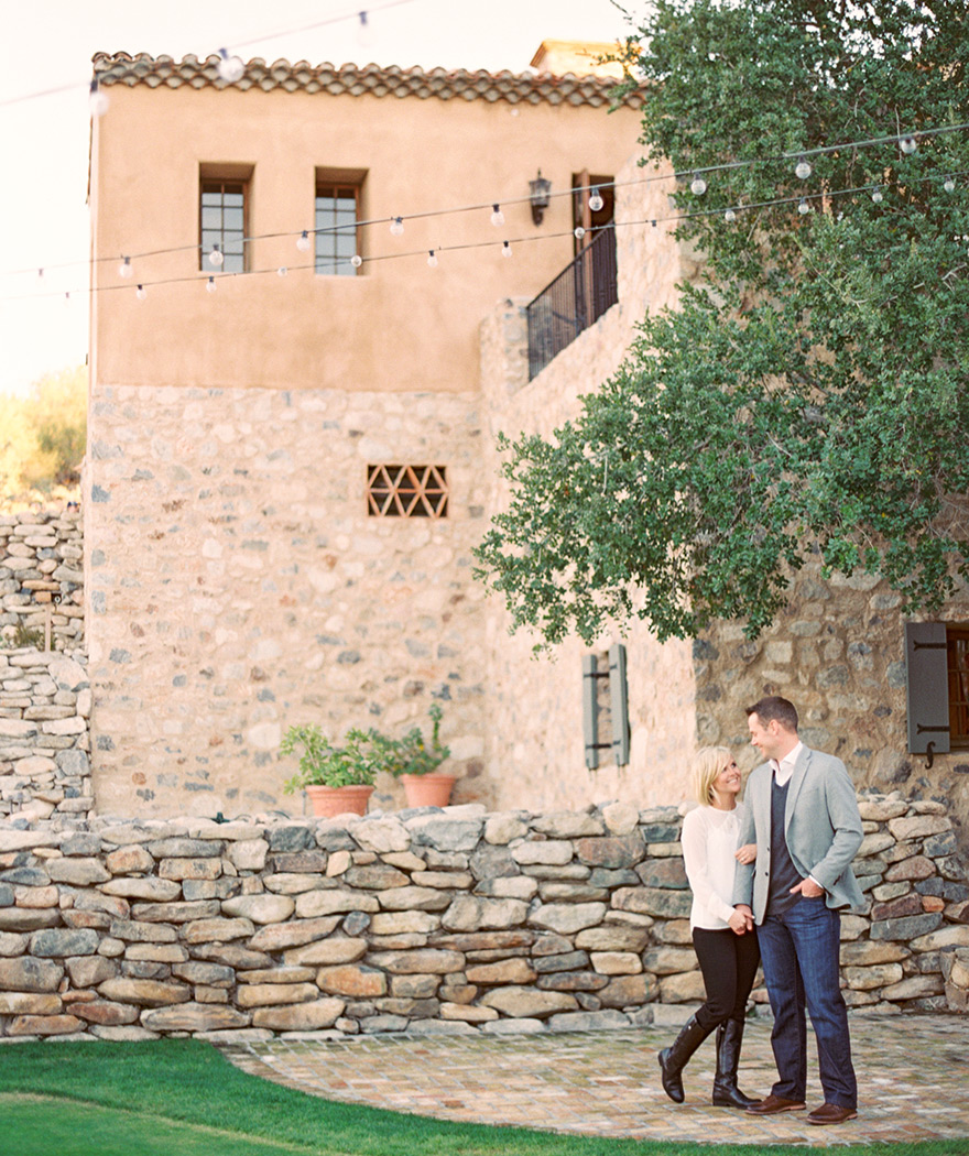 Engaged couple are happy in love outside rocky house photo shoot 