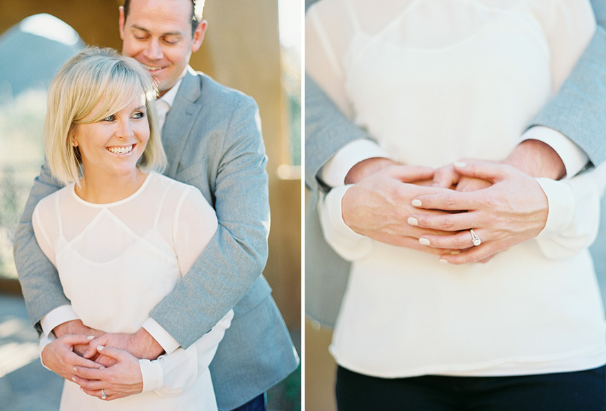 Groom hugs bride and shows exquisite ring in outdoor sunlight 