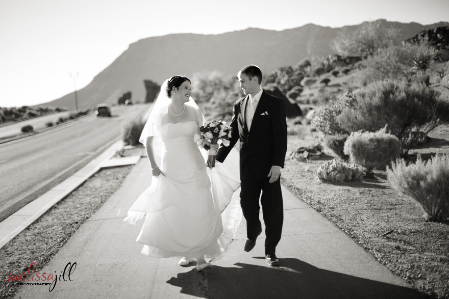 bride and groom walking on street
