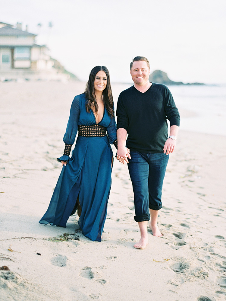 beach engagement shoot, blue cover-up for her & rolled up jeans for him