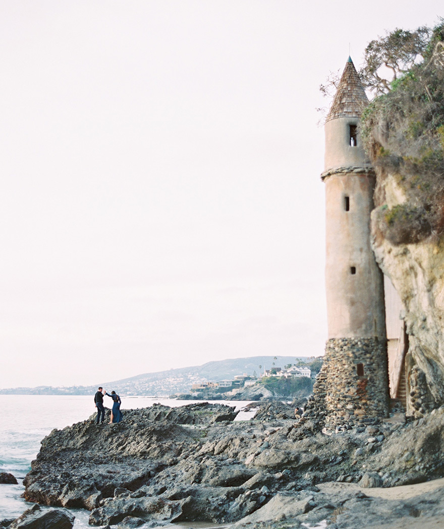 climbing the rocks beside La Tour at Victoria Beach