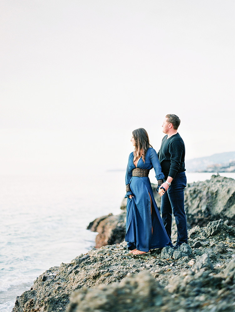 on the craggy rocks at Victoria Beach, engagement photos