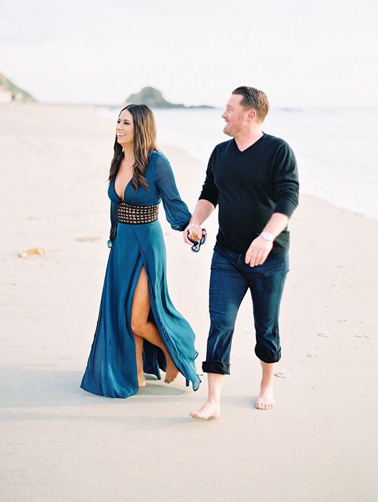 beach engagement shoot, blue cover-up for her & rolled up jeans for him