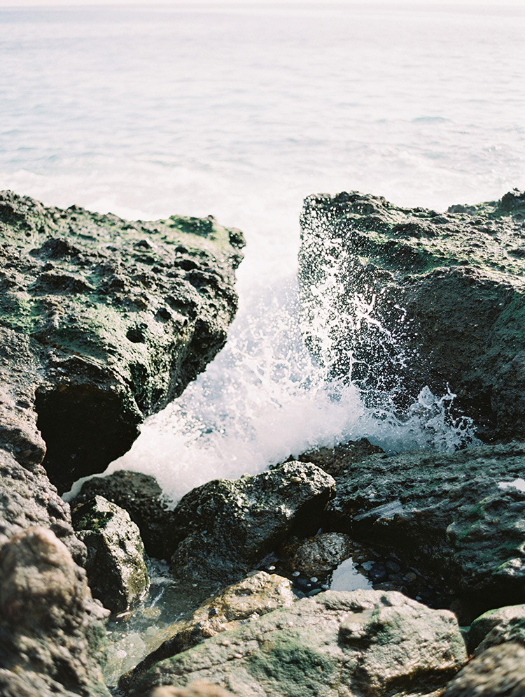waves break on the rocks at Victoria Beach