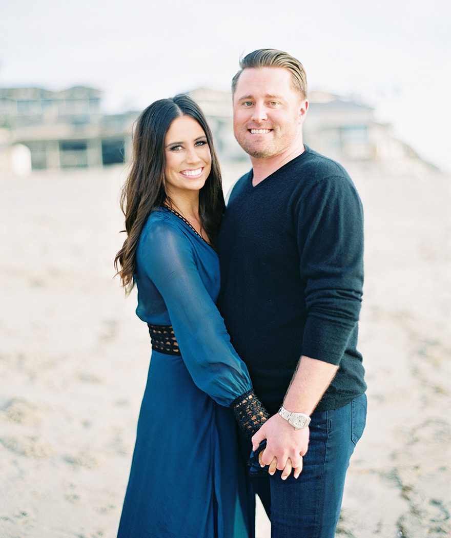 beach engagement shoot, blue cover-up for her & rolled up jeans for him