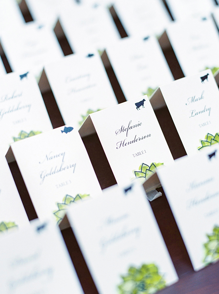 Escort cards with colorful custom illustrations of succulents. Reception ideas for a desert theme.