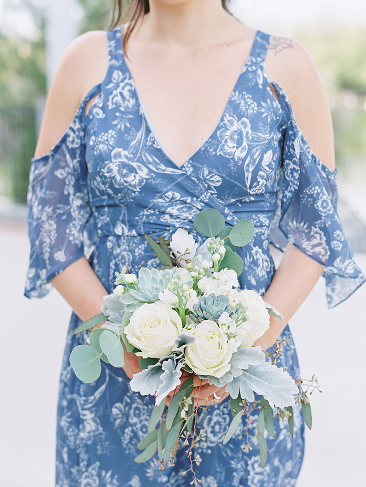 bridesmaid in blue patterned dress
