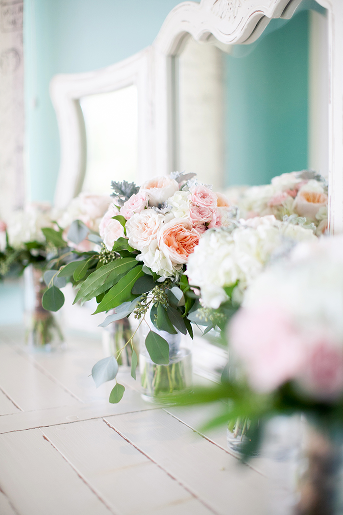 Gorgeous bouquets and floral arrangements of light pink and peach flowers.