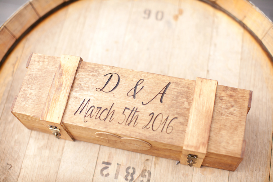 Custom engraved wooden ring box with bride & groom initials and wedding day.