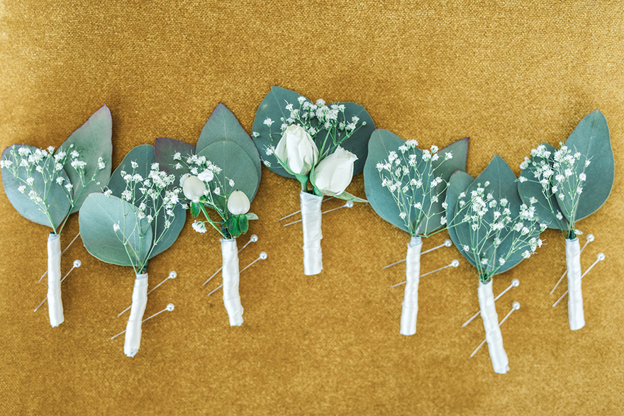 simple boutonnieres with baby's breath & greenery